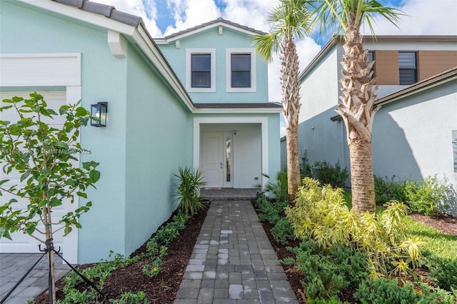 16450 Sea Turtle Pl, Loxahatchee, FL 33470 - entrance to property featuring stucco siding