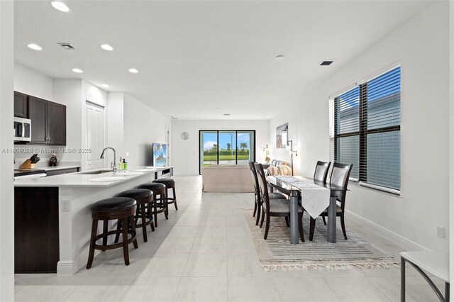 16450 Sea Turtle Pl, Loxahatchee, FL 33470 - dining room with recessed lighting, light tile patterned floors, and baseboards