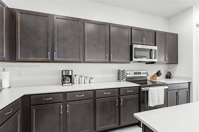 16450 Sea Turtle Pl, Loxahatchee, FL 33470 - kitchen with appliances with stainless steel finishes and light countertops