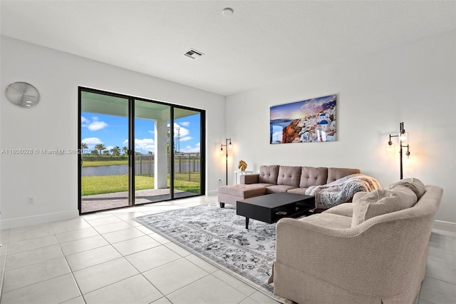 16450 Sea Turtle Pl, Loxahatchee, FL 33470 - living area with baseboards, a water view, and light tile patterned floors