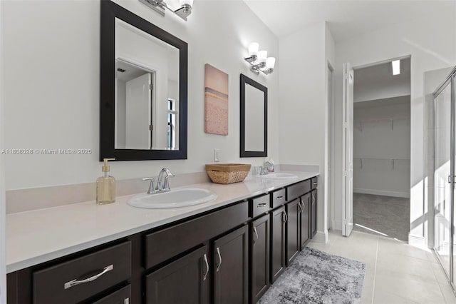 16450 Sea Turtle Pl, Loxahatchee, FL 33470 - full bathroom with double vanity, tile patterned flooring, a shower with door, and a spacious closet