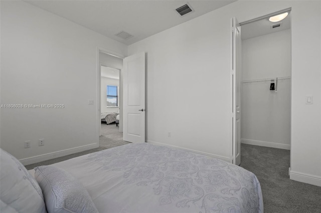 16450 Sea Turtle Pl, Loxahatchee, FL 33470 - bedroom featuring carpet, a walk in closet, baseboards, and a closet