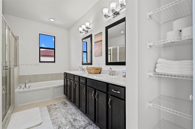 16450 Sea Turtle Pl, Loxahatchee, FL 33470 - bathroom with a garden tub, a stall shower, double vanity, and tile patterned floors