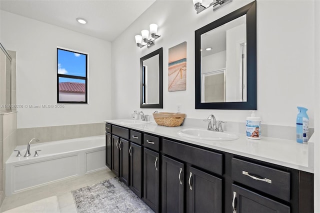16450 Sea Turtle Pl, Loxahatchee, FL 33470 - full bathroom featuring a garden tub, double vanity, an enclosed shower, and tile patterned flooring