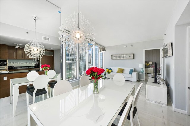 485 Brickell Ave Unit 1604, Miami, FL 33131 - kitchen with modern cabinets, a sink, a wall of windows, a chandelier, and a view of city