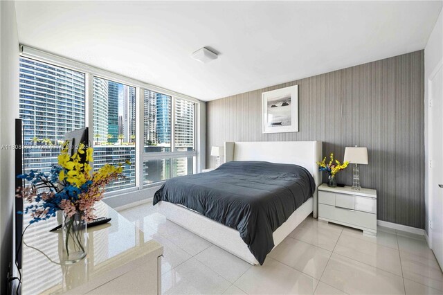 485 Brickell Ave Unit 1604, Miami, FL 33131 - bedroom featuring floor to ceiling windows and baseboards
