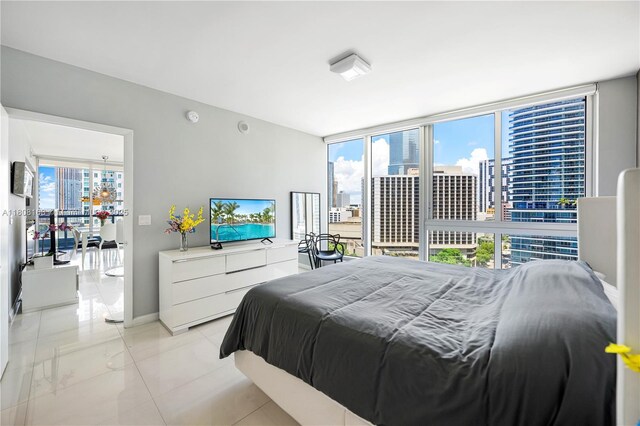 485 Brickell Ave Unit 1604, Miami, FL 33131 - bathroom with double vanity, a garden tub, baseboards, and tile patterned flooring