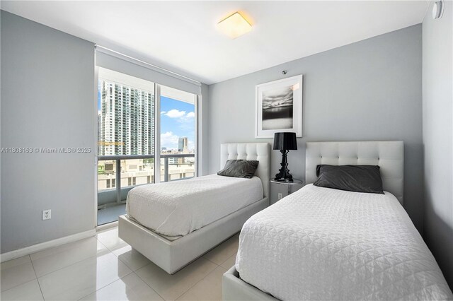 485 Brickell Ave Unit 1604, Miami, FL 33131 - full bath featuring toilet, a stall shower, vanity, tile patterned floors, and baseboards