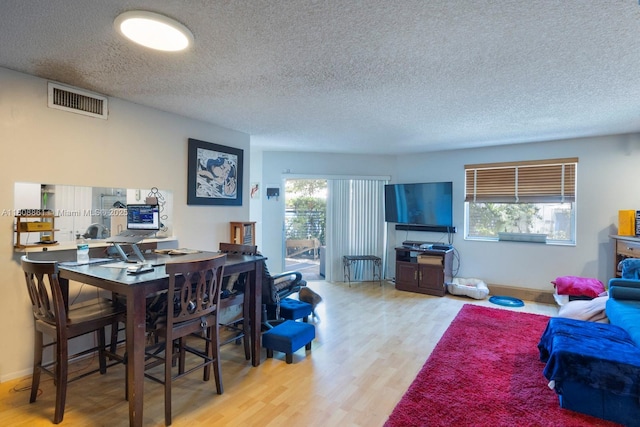 6870 SW 45th Ln Unit 8, Miami, FL 33155 - home office featuring a textured ceiling and wood finished floors