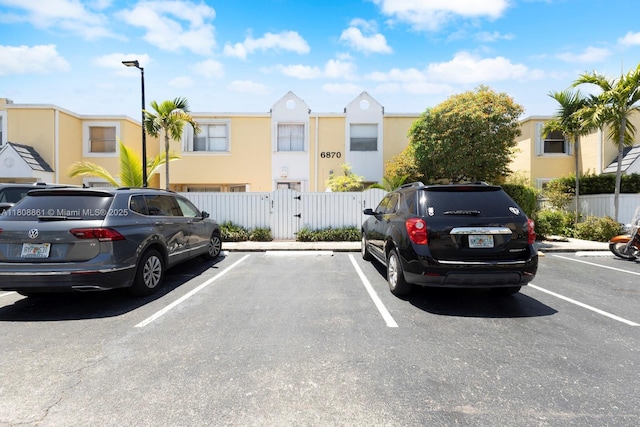 6870 SW 45th Ln Unit 8, Miami, FL 33155 - uncovered parking lot with a gate