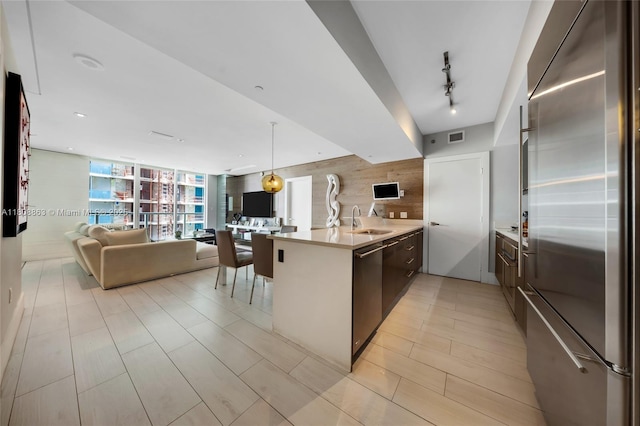 55 SE 6th St Unit 2803, Miami, FL 33131 - kitchen with appliances with stainless steel finishes, a peninsula, open floor plan, a sink, and modern cabinets