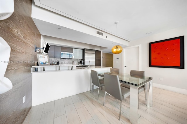 55 SE 6th St Unit 2803, Miami, FL 33131 - dining area with light wood-type flooring