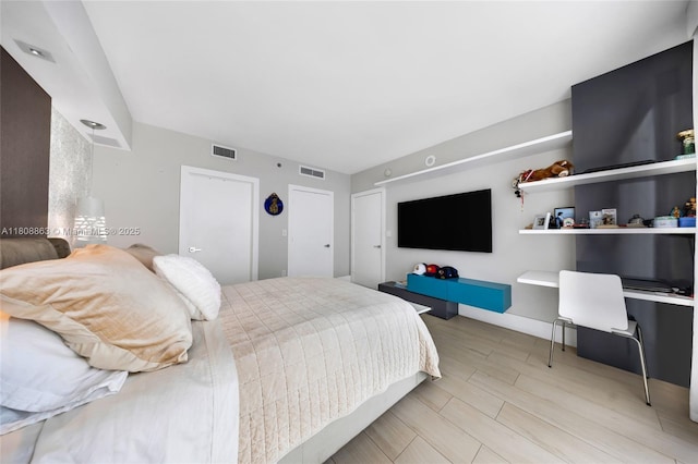 55 SE 6th St Unit 2803, Miami, FL 33131 - bedroom featuring light wood-style flooring and baseboards