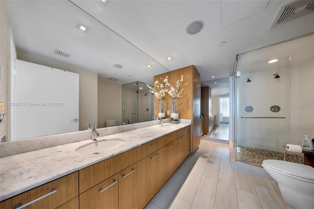 55 SE 6th St Unit 2803, Miami, FL 33131 - full bath featuring toilet, double vanity, and a shower stall