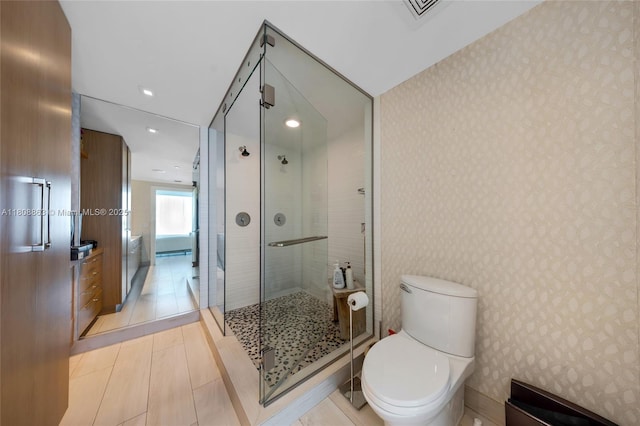 55 SE 6th St Unit 2803, Miami, FL 33131 - full bathroom featuring wallpapered walls, toilet, a shower stall, and recessed lighting