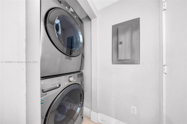 55 SE 6th St Unit 2803, Miami, FL 33131 - washroom with electric panel and stacked washer / dryer