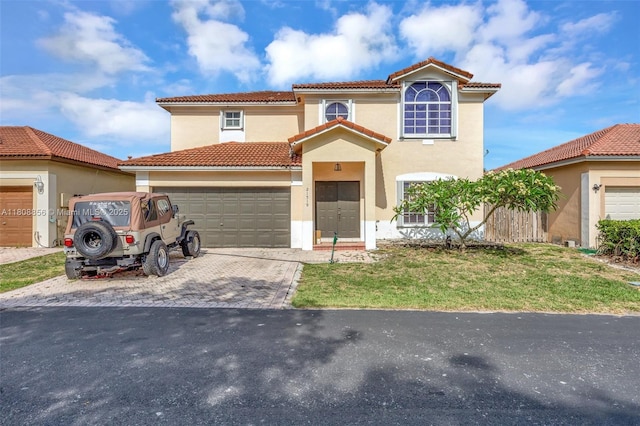 21519 SW 90th Ave, Cutler Bay, FL 33189 - mediterranean / spanish-style house featuring a tiled roof, stucco siding, driveway, an attached garage, and a front yard