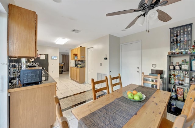 21519 SW 90th Ave, Cutler Bay, FL 33189 - dining space with a ceiling fan and light tile patterned flooring