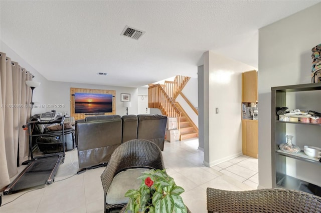 21519 SW 90th Ave, Cutler Bay, FL 33189 - living room with stairway, light tile patterned floors, a textured ceiling, and baseboards