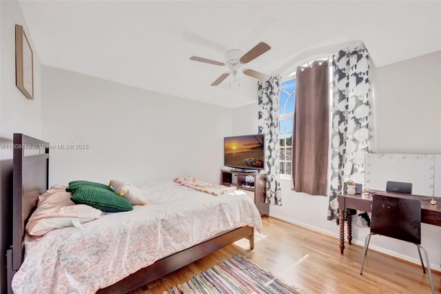 21519 SW 90th Ave, Cutler Bay, FL 33189 - bedroom featuring lofted ceiling, wood finished floors, ceiling fan, and baseboards