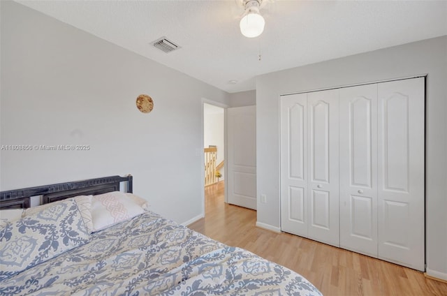 21519 SW 90th Ave, Cutler Bay, FL 33189 - bedroom with wood finished floors, baseboards, a closet, and a ceiling fan