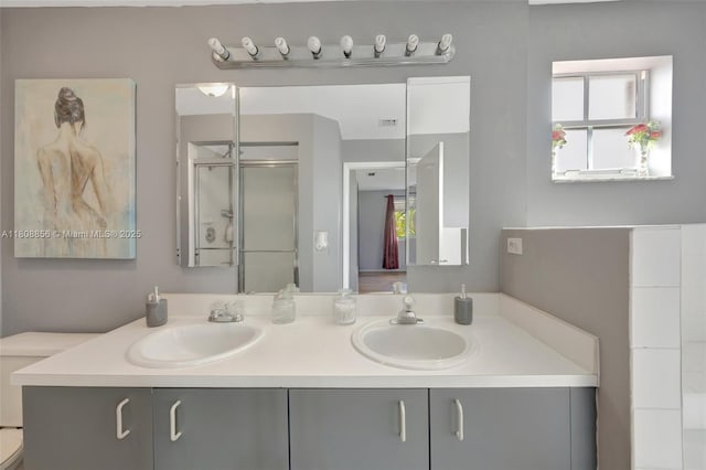 21519 SW 90th Ave, Cutler Bay, FL 33189 - full bathroom with double vanity, a stall shower, and toilet