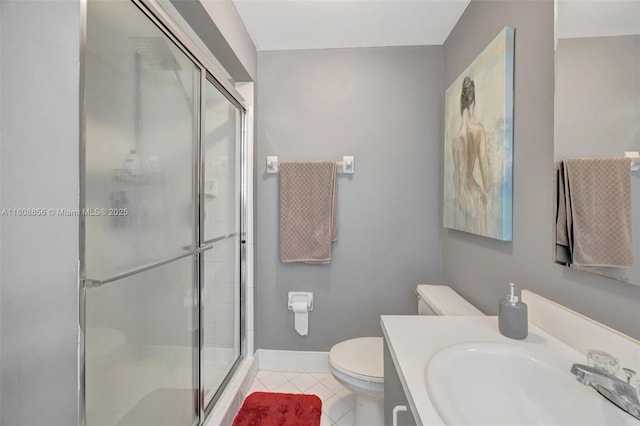 21519 SW 90th Ave, Cutler Bay, FL 33189 - bathroom with toilet, a stall shower, tile patterned floors, and vanity