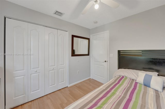 21519 SW 90th Ave, Cutler Bay, FL 33189 - bedroom with wood finished floors, a closet, baseboards, and a ceiling fan