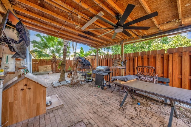 21519 SW 90th Ave, Cutler Bay, FL 33189 - fenced backyard with grilling area, ceiling fan, and a patio area