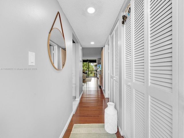 367 S Federal Hwy Unit B206, Deerfield Beach, FL 33441 - corridor featuring wood finished floors, recessed lighting, baseboards, and a textured ceiling