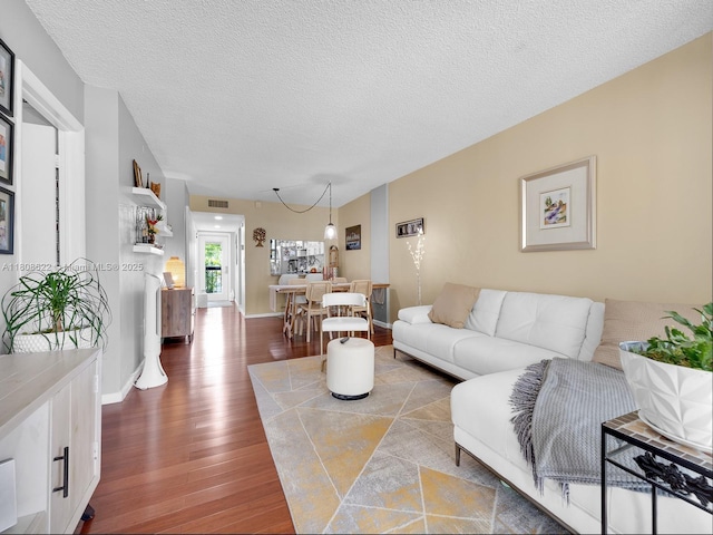 367 S Federal Hwy Unit B206, Deerfield Beach, FL 33441 - living area with wood finished floors, a textured ceiling, and baseboards