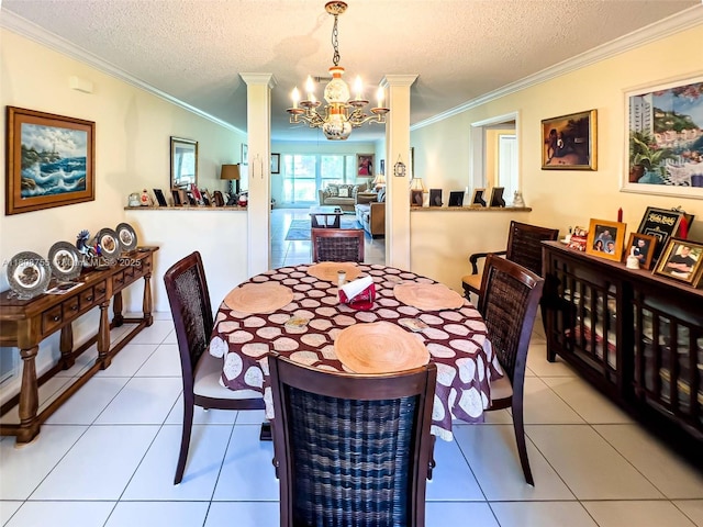 10198 Dovewood Ln Unit A, Boynton Beach, FL 33436 - dining space with crown molding, a chandelier, a textured ceiling, and tile patterned flooring