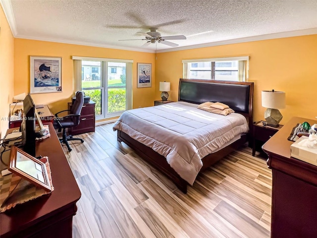 10198 Dovewood Ln Unit A, Boynton Beach, FL 33436 - bedroom with a textured ceiling, multiple windows, crown molding, an office area, and wood finished floors