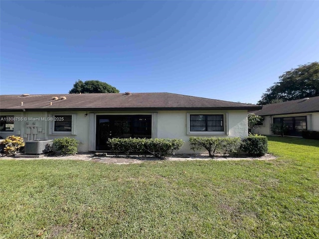 10198 Dovewood Ln Unit A, Boynton Beach, FL 33436 - view of front of property featuring stucco siding, central AC, and a front yard