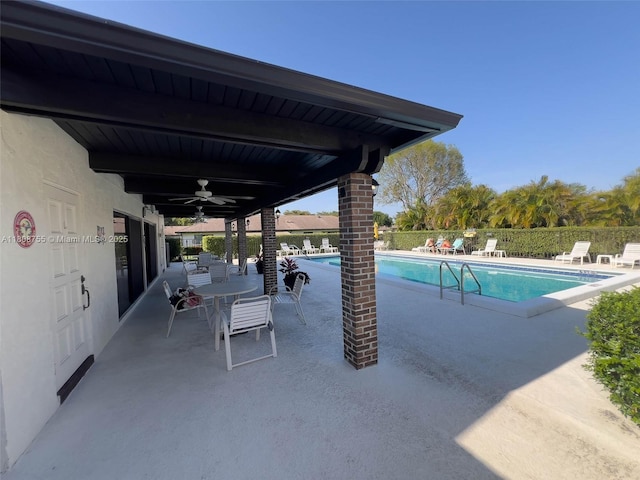 10198 Dovewood Ln Unit A, Boynton Beach, FL 33436 - community pool with a ceiling fan and a patio