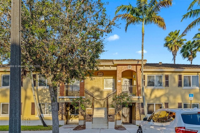 945 NE 34th Ave Unit 103, Homestead, FL 33033 - view of building exterior with stairway