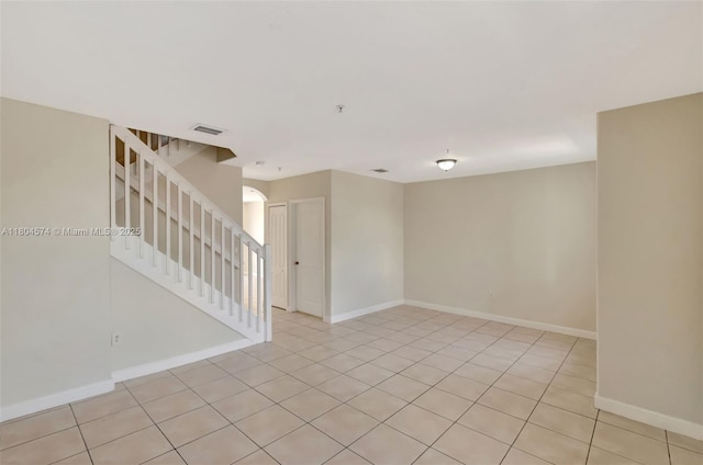 8199 W 36th Ave Unit 5, Hialeah, FL 33018 - spare room with stairs, baseboards, and light tile patterned floors