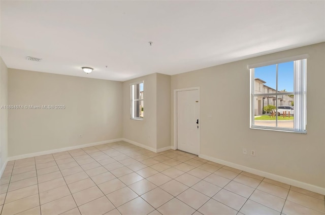 8199 W 36th Ave Unit 5, Hialeah, FL 33018 - unfurnished room with healthy amount of natural light and baseboards