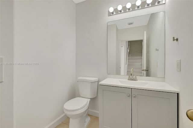 8199 W 36th Ave Unit 5, Hialeah, FL 33018 - bathroom with toilet, vanity, baseboards, and tile patterned floors