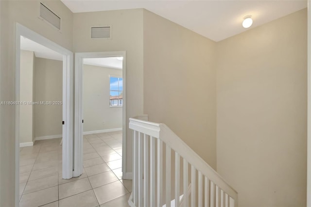 8199 W 36th Ave Unit 5, Hialeah, FL 33018 - hall featuring an upstairs landing, light tile patterned flooring, and baseboards