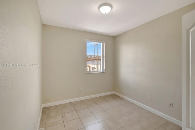 8199 W 36th Ave Unit 5, Hialeah, FL 33018 - spare room featuring light tile patterned floors and baseboards