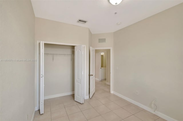 8199 W 36th Ave Unit 5, Hialeah, FL 33018 - unfurnished bedroom featuring light tile patterned floors and a closet