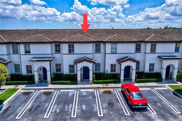 8199 W 36th Ave Unit 5, Hialeah, FL 33018 - townhome / multi-family property featuring uncovered parking and stucco siding
