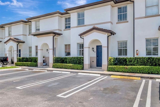 8199 W 36th Ave Unit 5, Hialeah, FL 33018 - view of front of property featuring stucco siding and uncovered parking