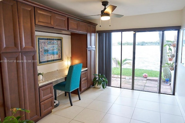20105 NE 3rd Ct Unit 9, Miami, FL 33179 - home office with a water view, ceiling fan, and light tile patterned floors