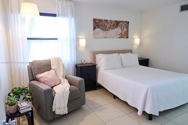 20105 NE 3rd Ct Unit 9, Miami, FL 33179 - bedroom with light tile patterned floors