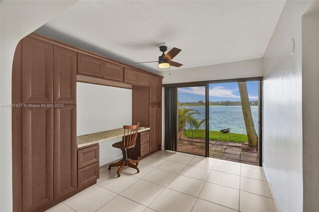 20105 NE 3rd Ct Unit 9, Miami, FL 33179 - bedroom featuring light tile patterned floors and an office area