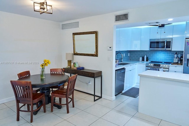 20105 NE 3rd Ct Unit 9, Miami, FL 33179 - dining room with light tile patterned floors and baseboards