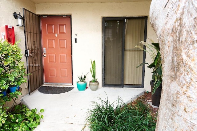 20105 NE 3rd Ct Unit 9, Miami, FL 33179 - doorway to property featuring stucco siding