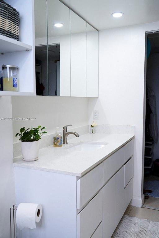 20105 NE 3rd Ct Unit 9, Miami, FL 33179 - bathroom with vanity, recessed lighting, and tile patterned flooring